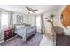 Charming bedroom featuring hardwood floors, a vintage dresser, and a cozy bed, offering a warm, inviting ambiance at 468 Windol Ct, Marietta, GA 30066