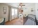 Bright bedroom featuring ceiling fan, natural light, and decoratively designed with a sporty theme at 468 Windol Ct, Marietta, GA 30066