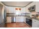 Well-lit kitchen features stainless steel appliances, granite countertops, and white cabinetry at 468 Windol Ct, Marietta, GA 30066