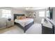 Spacious bedroom suite boasts modern decor, art, dual windows, and a soothing, inviting atmosphere at 468 Windol Ct, Marietta, GA 30066