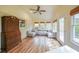 Cozy sun room with hardwood floors, ceiling fan, and ample seating at 468 Windol Ct, Marietta, GA 30066