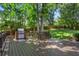 Backyard featuring an outdoor grill and entertainment area with a beautiful lawn at 788 Old Paper Mill Dr, Marietta, GA 30067