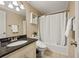 Bathroom featuring shower, toilet and granite countertop at 788 Old Paper Mill Dr, Marietta, GA 30067