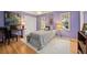 Comfortable bedroom features wood floors, artwork and windows at 788 Old Paper Mill Dr, Marietta, GA 30067