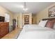 Bright bedroom with hardwood floors, a neutral color palette, and a comfortable queen-size bed at 788 Old Paper Mill Dr, Marietta, GA 30067