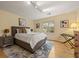 Bedroom with a queen bed, neutral walls, and a large window at 788 Old Paper Mill Dr, Marietta, GA 30067