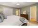 Bedroom featuring hardwood floors, neutral paint, and white closet doors and trim at 788 Old Paper Mill Dr, Marietta, GA 30067