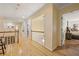 Upstairs hallway with hardwood floors, railing, and bedroom entrances at 788 Old Paper Mill Dr, Marietta, GA 30067