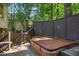 Enjoy a private retreat with this deck featuring a relaxing hot tub and scenic views, perfect for relaxation at 788 Old Paper Mill Dr, Marietta, GA 30067