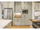 A kitchen with stainless steel refrigerator, custom cabinets, and a built-in microwave at 788 Old Paper Mill Dr, Marietta, GA 30067