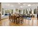 Living room with hardwood floors, skylight, many windows and a large wood table at 788 Old Paper Mill Dr, Marietta, GA 30067