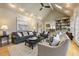 Living room featuring fireplace, comfortable furniture, hardwood floors, and natural light at 788 Old Paper Mill Dr, Marietta, GA 30067