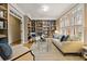 Cozy living room with custom built-in bookshelves and lots of natural light at 788 Old Paper Mill Dr, Marietta, GA 30067