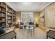 Bright living room with a large window, built-in bookshelves, and neutral decor at 788 Old Paper Mill Dr, Marietta, GA 30067