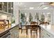 Open concept living and dining room with hardwood floors and lots of natural light at 788 Old Paper Mill Dr, Marietta, GA 30067