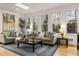 Living room with hardwood floors, recessed lighting, and multiple windows showcasing the outdoor view at 788 Old Paper Mill Dr, Marietta, GA 30067