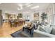 Open concept living room with hardwood floors, a skylight, and large windows for natural light at 788 Old Paper Mill Dr, Marietta, GA 30067