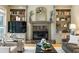Living room featuring fireplace, built-in bookshelves and comfortable seating arrangements at 788 Old Paper Mill Dr, Marietta, GA 30067