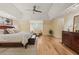 A bright main bedroom has hardwood floors, tray ceilings, a sitting area and lots of light at 788 Old Paper Mill Dr, Marietta, GA 30067