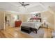 Spacious main bedroom features hardwood floors, tray ceiling, ceiling fan, and sitting area at 788 Old Paper Mill Dr, Marietta, GA 30067