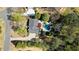 This aerial view showcases a home with a pool, lush trees, and well-maintained grounds at 11630 Mountain Laurel Dr, Roswell, GA 30075