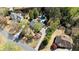 An aerial view of the home showcases the beautiful pool, surrounding landscape, and neighborhood at 11630 Mountain Laurel Dr, Roswell, GA 30075