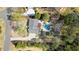 Aerial view shows large lot, in-ground pool, mature trees and surrounding landscaping at 11630 Mountain Laurel Dr, Roswell, GA 30075