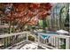 Scenic backyard with pool, outdoor fireplace, jacuzzi and mature trees providing privacy at 11630 Mountain Laurel Dr, Roswell, GA 30075
