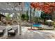 Relaxing backyard features a pool, outdoor fireplace, built-in grill and mature trees at 11630 Mountain Laurel Dr, Roswell, GA 30075