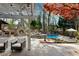 Relaxing backyard features a pool, outdoor fireplace, built-in grill and mature trees at 11630 Mountain Laurel Dr, Roswell, GA 30075
