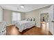 Cozy, neutral bedroom with hardwood floors and lots of natural light at 11630 Mountain Laurel Dr, Roswell, GA 30075