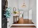 Inviting foyer with hardwood floors, a stylish pendant light, and a view into the home's interior at 11630 Mountain Laurel Dr, Roswell, GA 30075