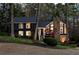 Charming two-story home featuring a stone chimney and a beautifully landscaped front yard at 11630 Mountain Laurel Dr, Roswell, GA 30075