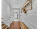 Stylish hallway with wood floors, ship lap, and wooden bench that leads to other rooms at 11630 Mountain Laurel Dr, Roswell, GA 30075