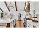 Bright and modern kitchen featuring a large island, stainless steel appliances, and white cabinetry at 11630 Mountain Laurel Dr, Roswell, GA 30075