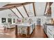 Spacious open-concept kitchen featuring a large island, white cabinets, and stainless steel appliances at 11630 Mountain Laurel Dr, Roswell, GA 30075