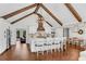 Beautiful kitchen with large island, seating, white cabinetry, and hardwood floors at 11630 Mountain Laurel Dr, Roswell, GA 30075