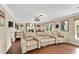 Spacious living room features a stone fireplace, hardwood floors, and comfortable seating at 11630 Mountain Laurel Dr, Roswell, GA 30075