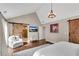 Comfortable main bedroom with vaulted ceilings, wood floors, en suite bathroom and cozy seating area at 11630 Mountain Laurel Dr, Roswell, GA 30075