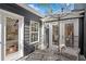 Cozy patio seating with a view of the kitchen and a private outdoor space at 11630 Mountain Laurel Dr, Roswell, GA 30075