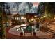 Lush backyard showcasing a pool with a waterfall feature, lounge area, and landscaped surroundings at 11630 Mountain Laurel Dr, Roswell, GA 30075
