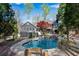 Beautiful backyard with in-ground pool, waterfall feature and stone landscaping, perfect for outdoor relaxation at 11630 Mountain Laurel Dr, Roswell, GA 30075