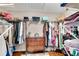 Well-organized walk-in closet with ample shelving and storage, and built-in dresser at 11630 Mountain Laurel Dr, Roswell, GA 30075