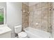 Tiled bathroom featuring shower and tub at 3317 Regent Sw Pl, Atlanta, GA 30311