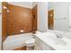 Bathroom featuring a tub with a tile surround and a white sink with a vanity at 3317 Regent Sw Pl, Atlanta, GA 30311