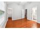 A bedroom shows beautiful hardwood floors, an attached bathroom, and a walk in closet at 3317 Regent Sw Pl, Atlanta, GA 30311