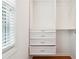 Organized closet features built in shelving and drawers for easy and accessible storage at 3317 Regent Sw Pl, Atlanta, GA 30311