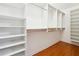Spacious walk-in closet with custom shelving and hardwood floors at 3317 Regent Sw Pl, Atlanta, GA 30311