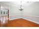 Dining room with classic chandelier and views to backyard at 3317 Regent Sw Pl, Atlanta, GA 30311