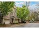 Elegant brick townhome with lush landscaping and driveway parking at 3317 Regent Sw Pl, Atlanta, GA 30311